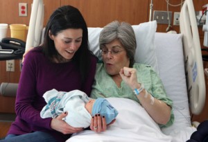 Sara Connell, left, and her mom Kristine Casey admire baby Finnean Connell at Prentice Women's Hospital in Chicago, Illinois, on Thursday, February 10, 2011. Casey, possibly the oldest woman to give birth in Illinois, served as a surrogate for her daughter, who had been trying for years to have a baby. (Stacey Wescott/Chicago Tribune/MCT)