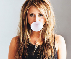 Woman blowing bubble gum