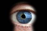 Man looking through keyhole