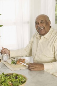 Man eating a salmon dinner