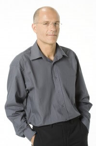 Man standing with hands in pockets