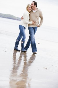 Romantic couple walking on beach