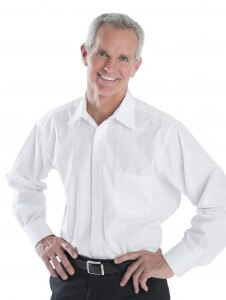 Mid-age man, hands on hips, smiling