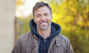 mid age man outdoors, smiling