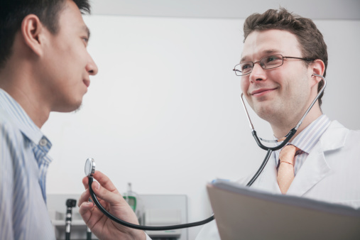 medical doctor using a stethoscope