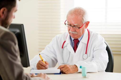 medical doctor writing a perscription