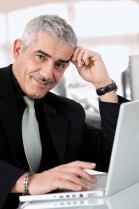 mid age man using a computer