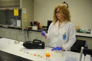 An FDA technician demonstrates a sophisticated portable device that the agency is using to detect counterfeit drugs.