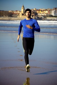 man jogging on a beach