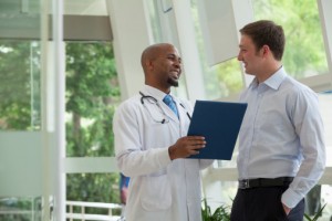 doctor with young male patient