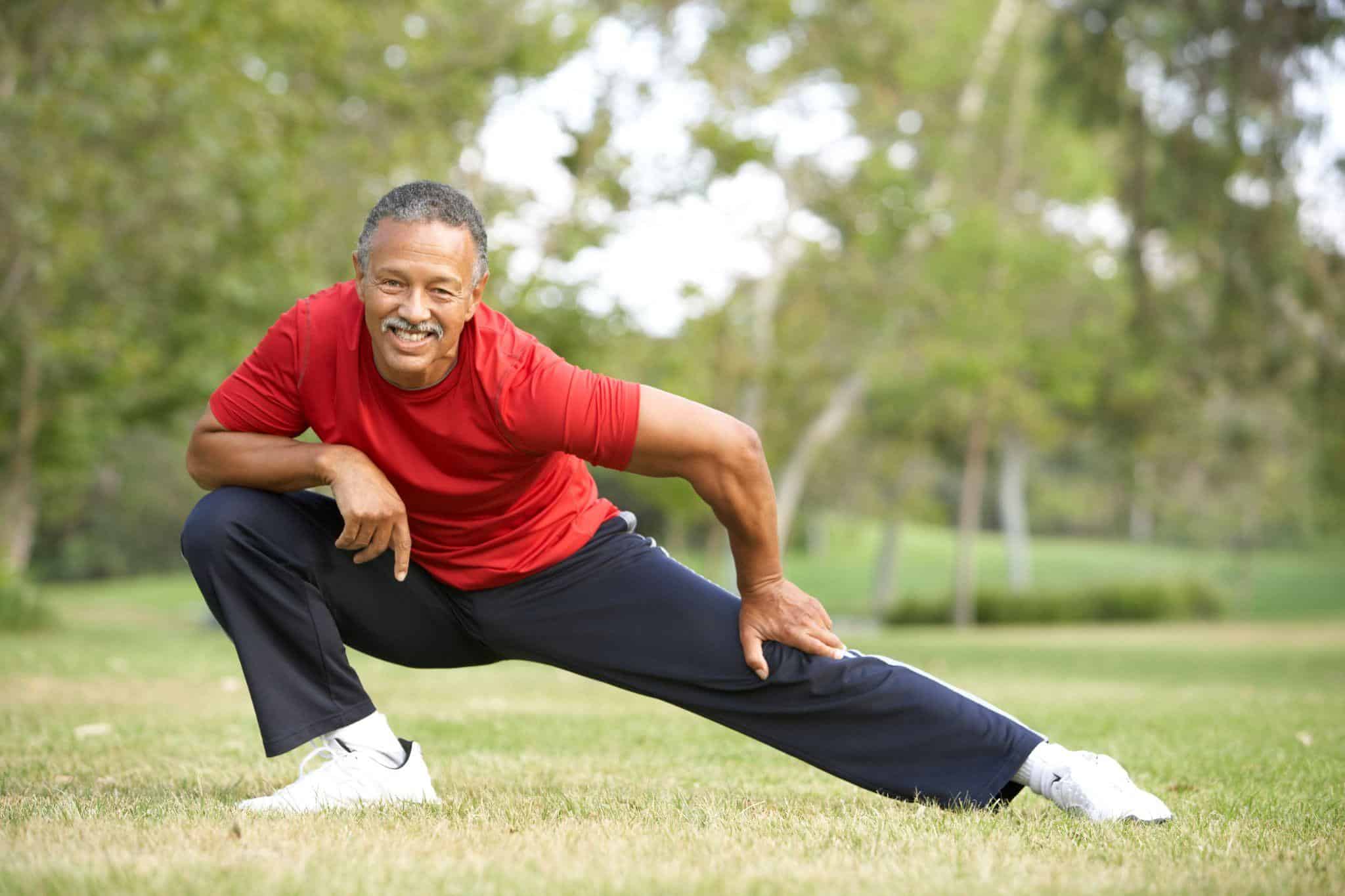 A Man Working Out Middle-Aged Man Stretching before taking Viagra