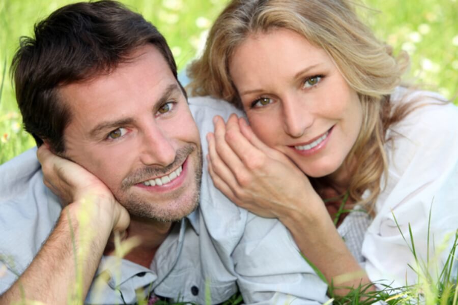 Couple smiling.