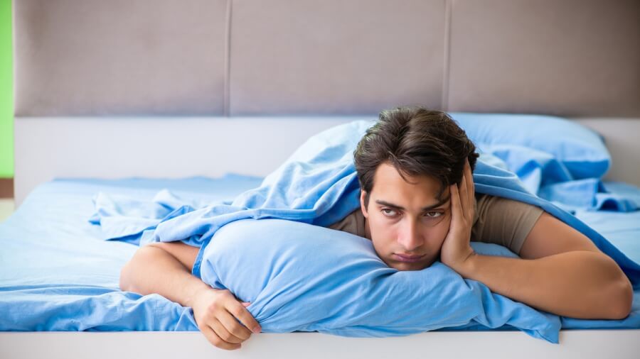 Man unable to fall asleep.