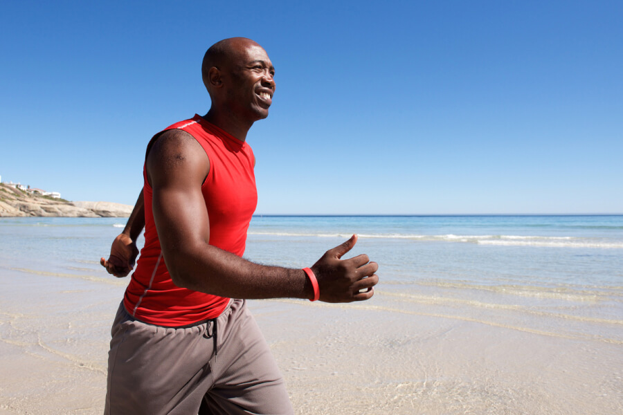 Man running on a beach.