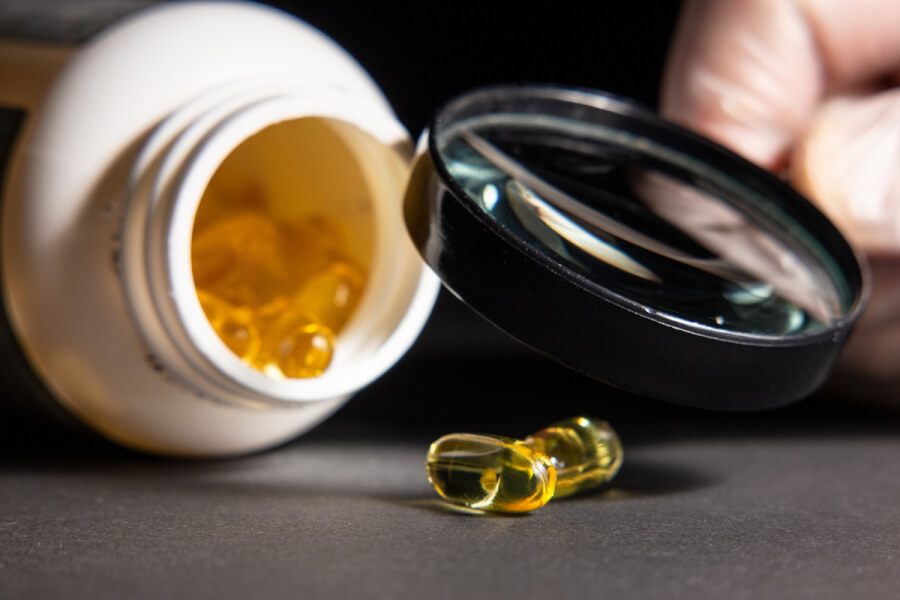 Bottle of pills lying on its side.