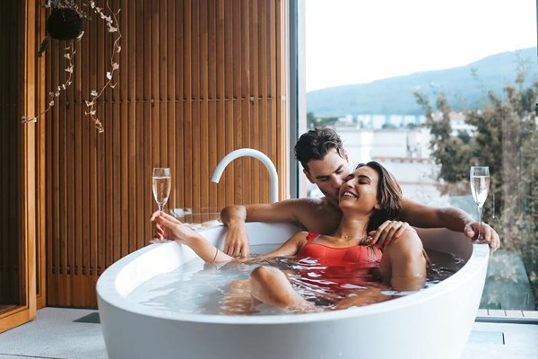 Happy couple taking a bath together
