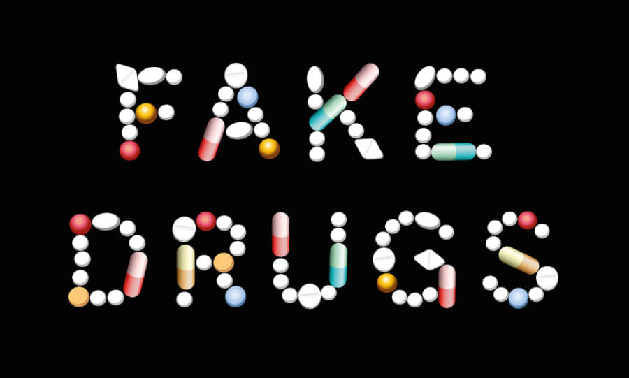 The words fake drugs spelled out with pills.
