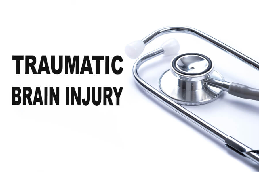 Stethoscope with the words traumatic brain injury.