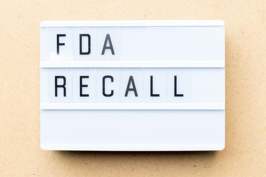 FDA recall words on a white sign.