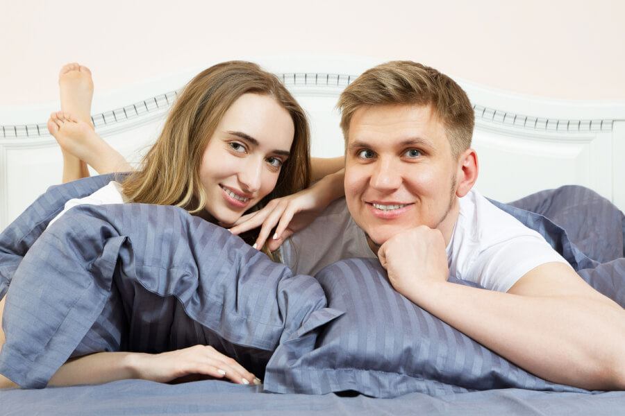 Happy couple lying together.