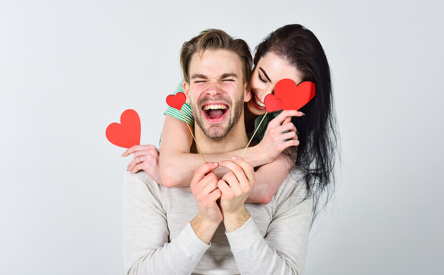 Smiling couple hugging.