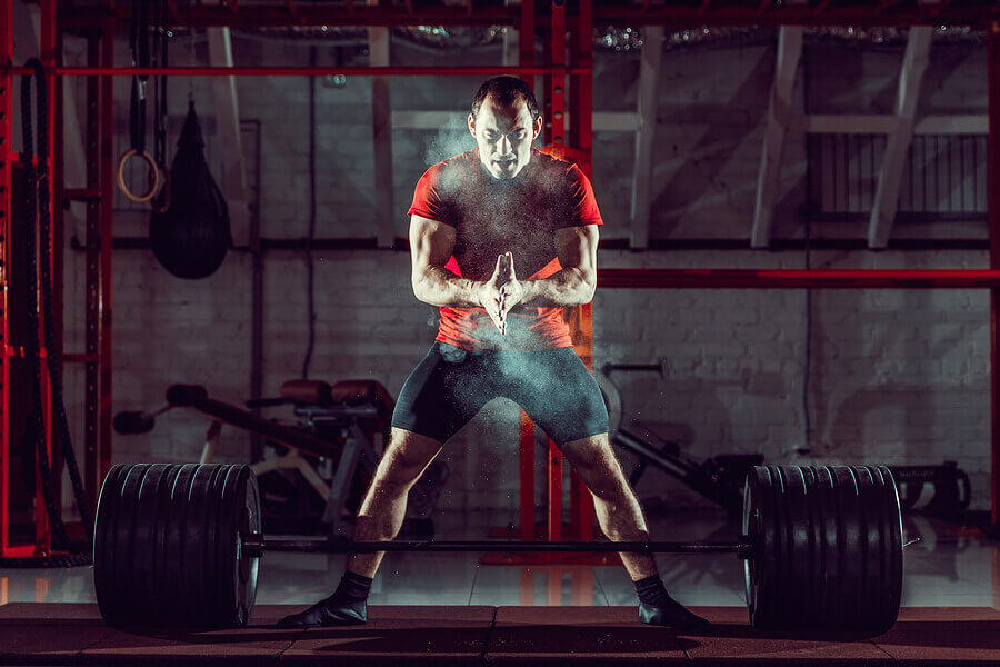 Man getting ready to lift a barbell.