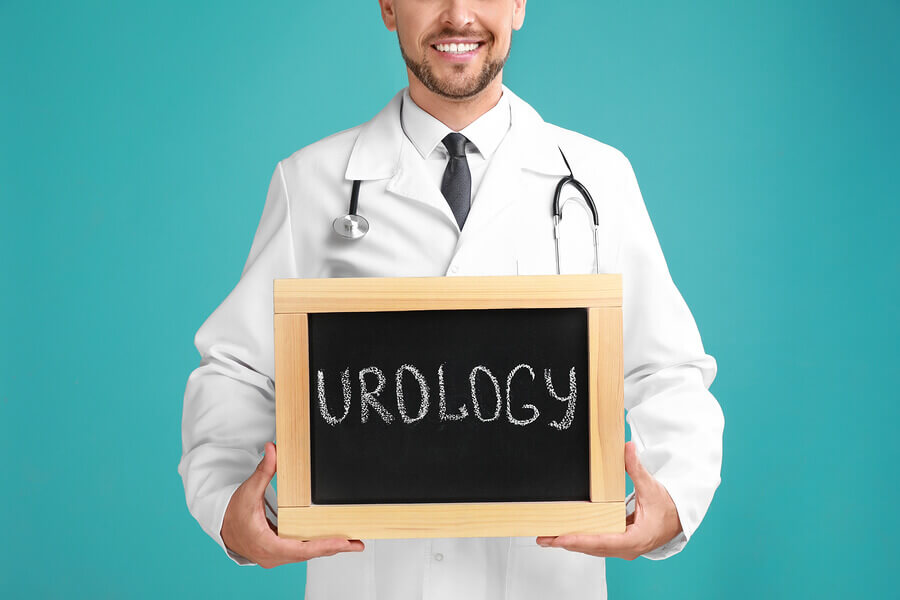 Medical doctor holding a sign labeled urology.