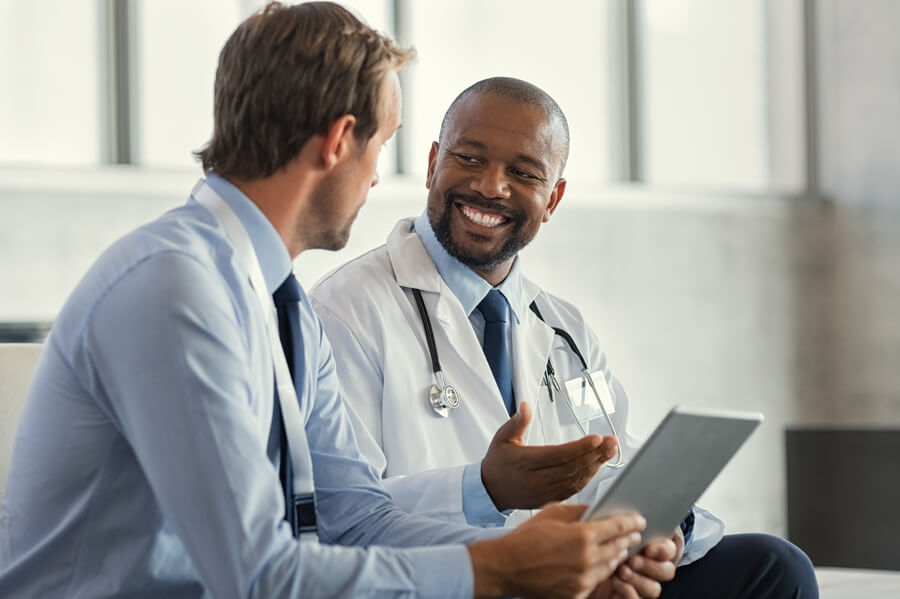 Medical doctor speaking with a patient
