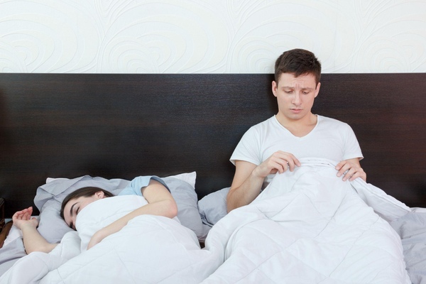Disappointed man in bed Disappointed man in bed