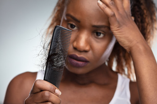 looking at hair stuck in a comb looking at hair stuck in a comb