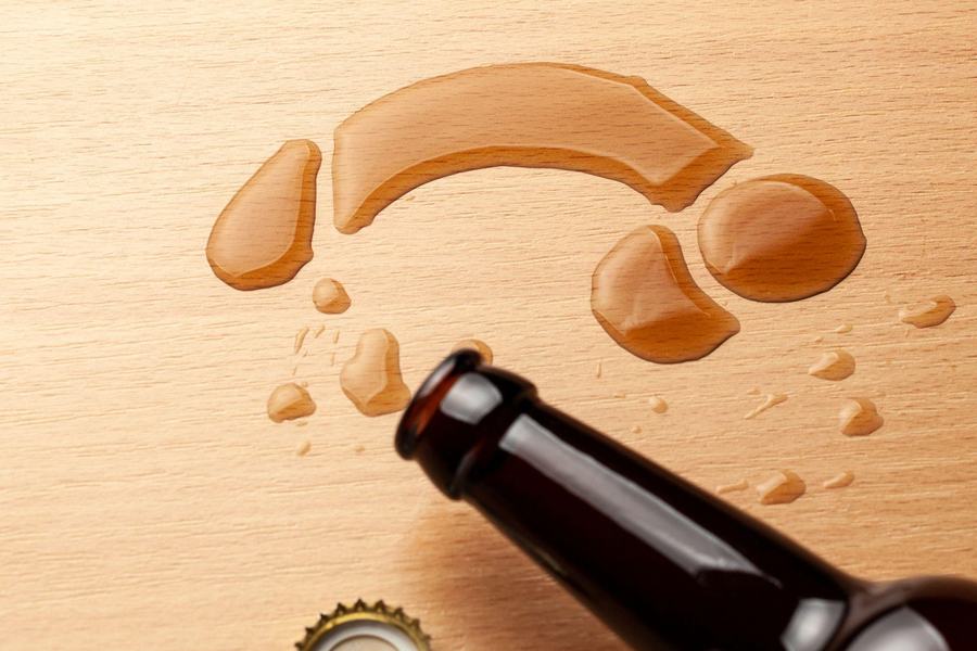 Spilled beverage in the shape of male anatomy.