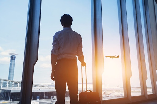 Man looking at a plane leaving Man looking at a plane leaving