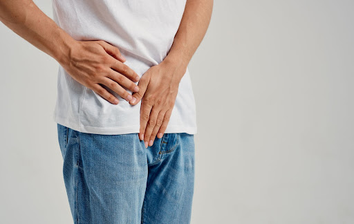 holding groin area holding groin area