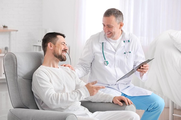 Doctor and patient smiling Doctor and patient smiling