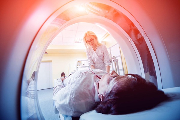 Woman in a CT scan machine Woman in a CT scan machine