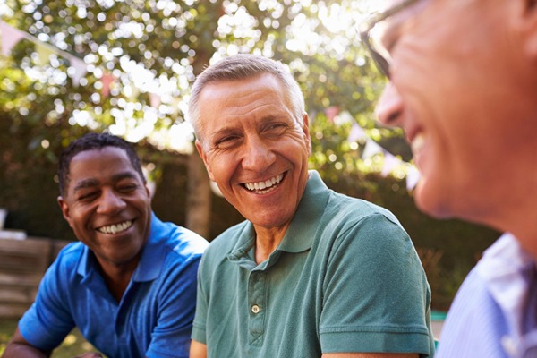 Men talking and smiling Men talking and smiling