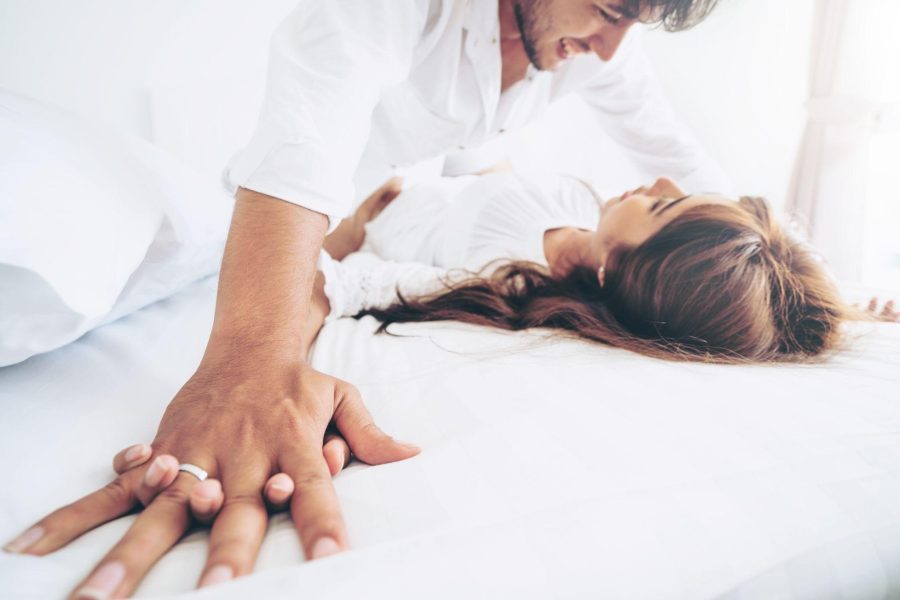 playful couple in bed