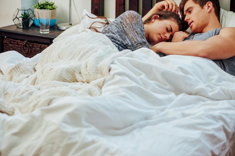young couple resting in bed