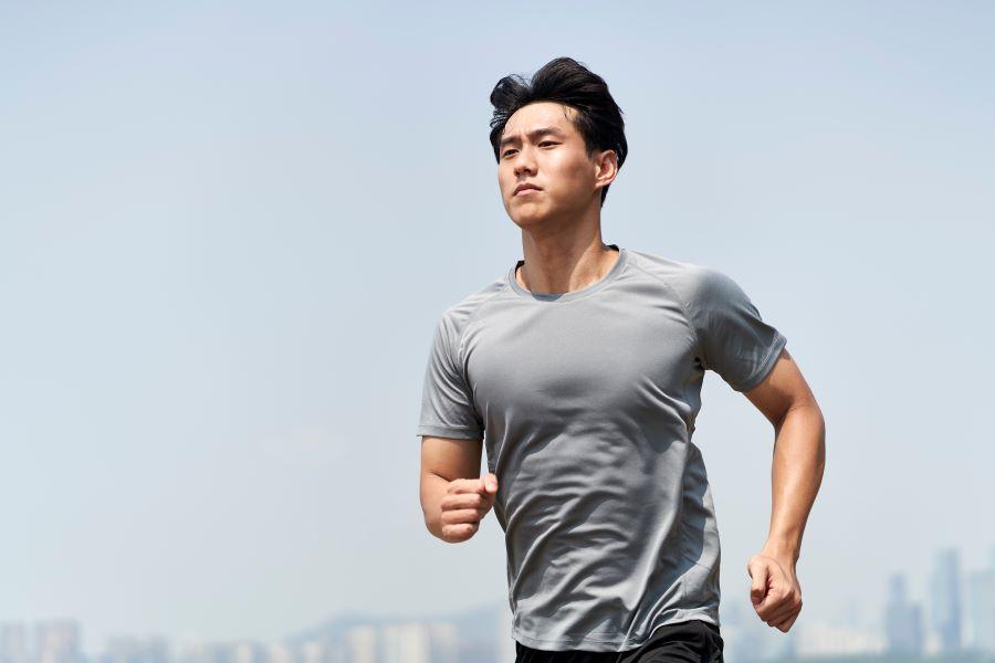 young asian man jogging