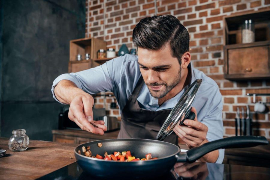 young man cooking
