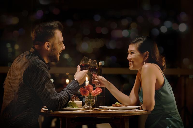happy young couple having drinks