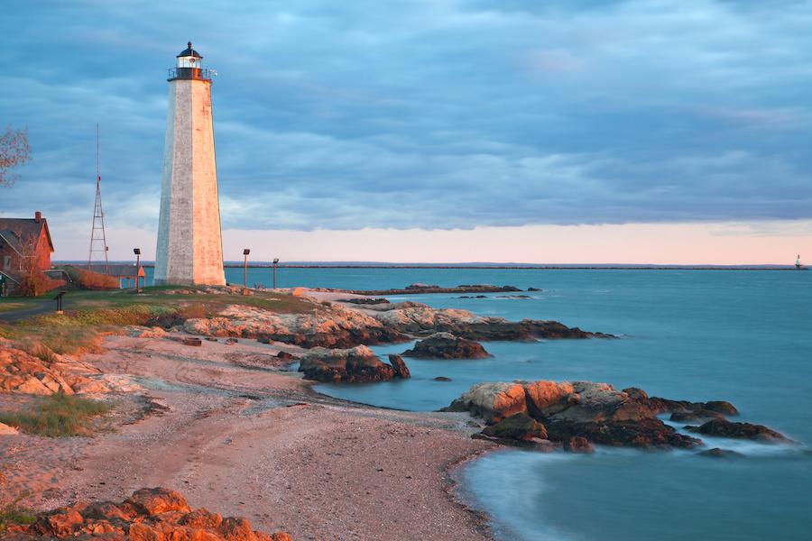 a lighthouse at a shore in connecticut