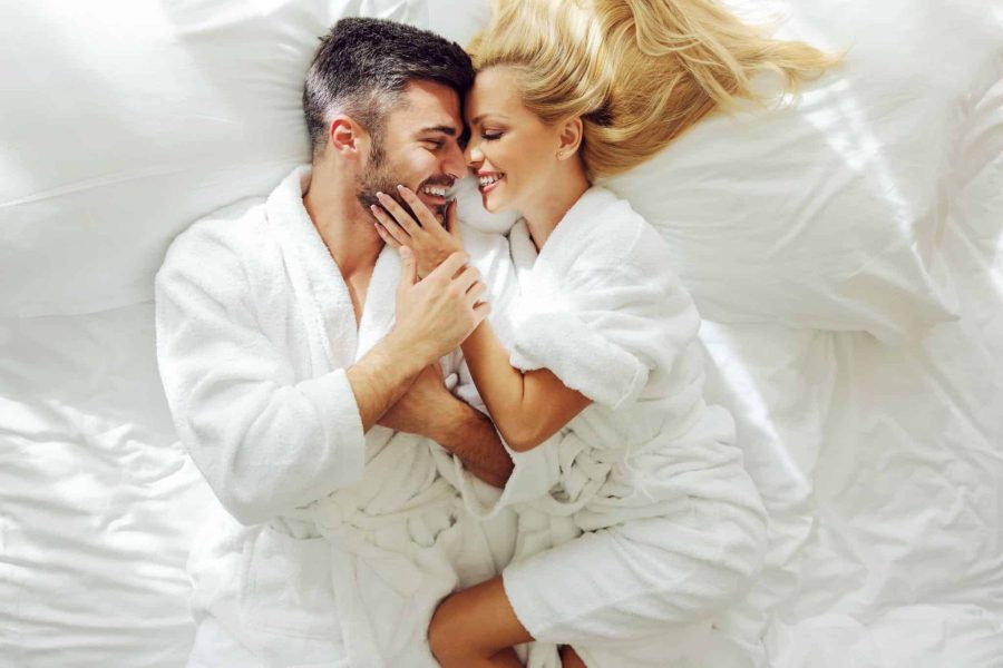 happy couple in bed
