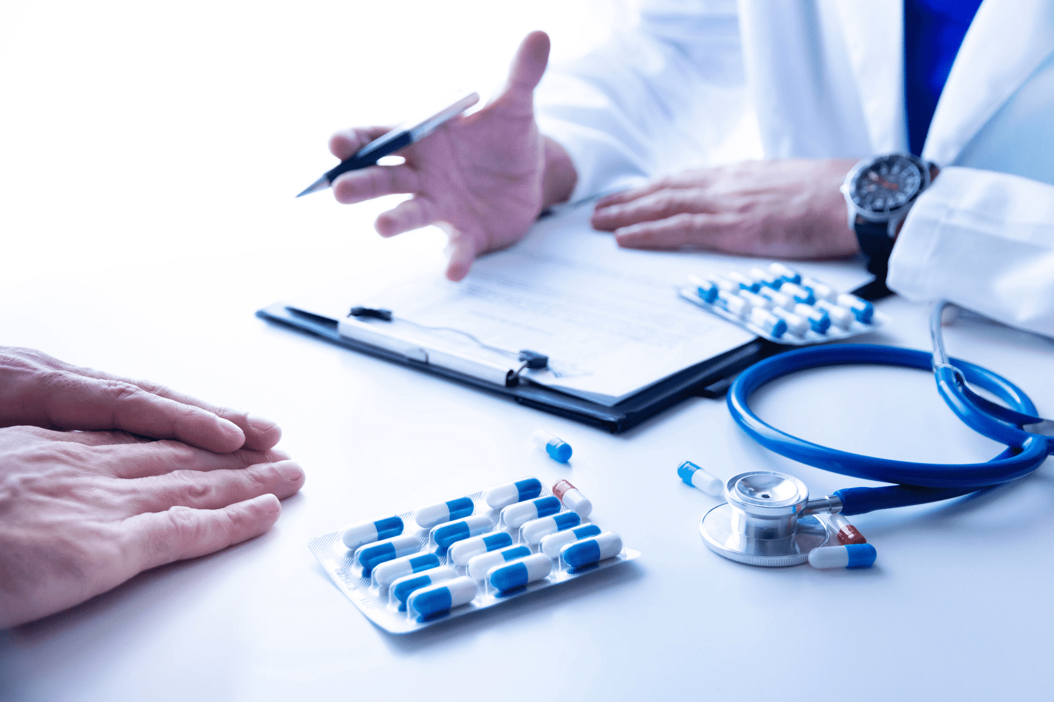 doctor prescribing medicine to patient