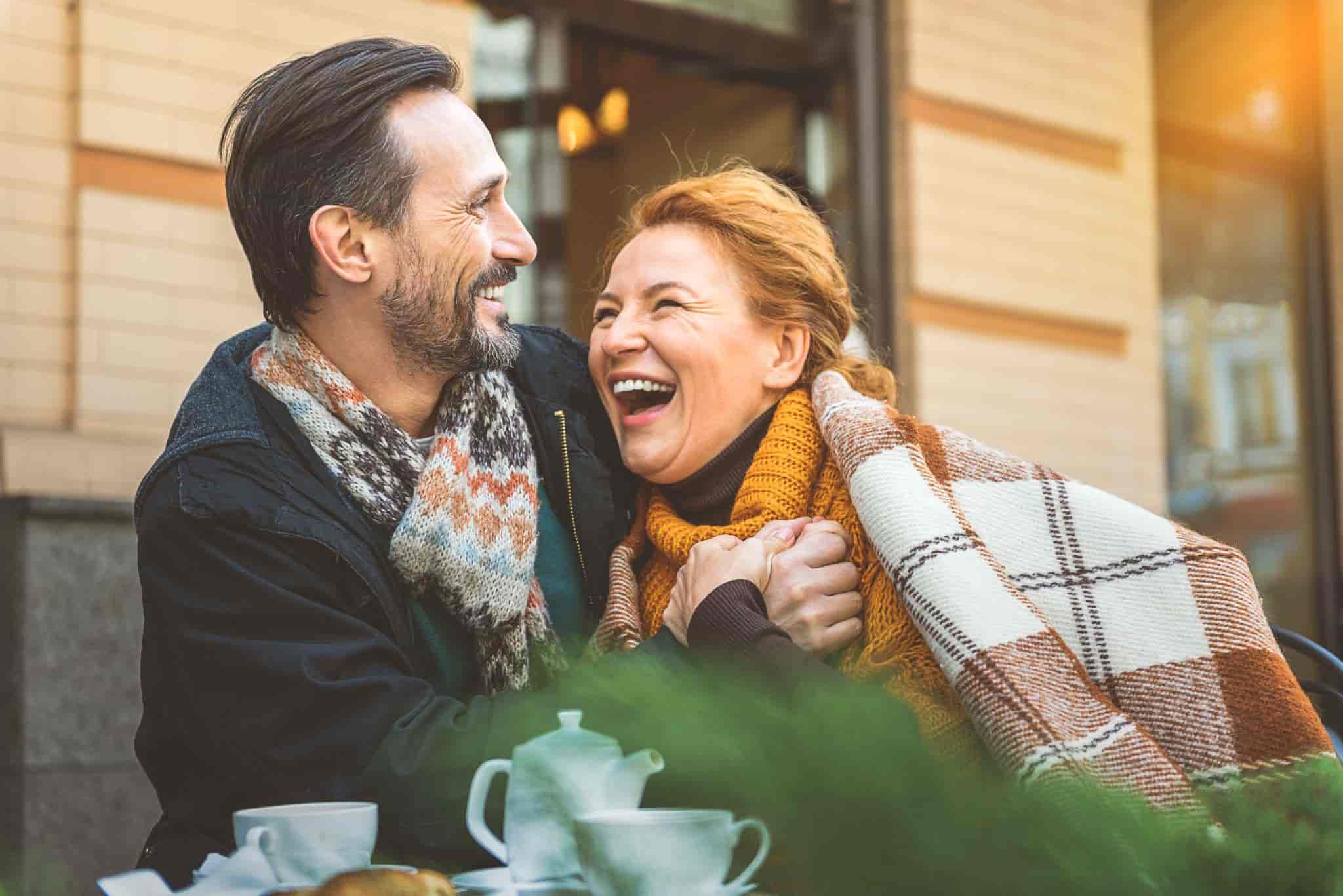 happy middle-aged couple at a cafe
