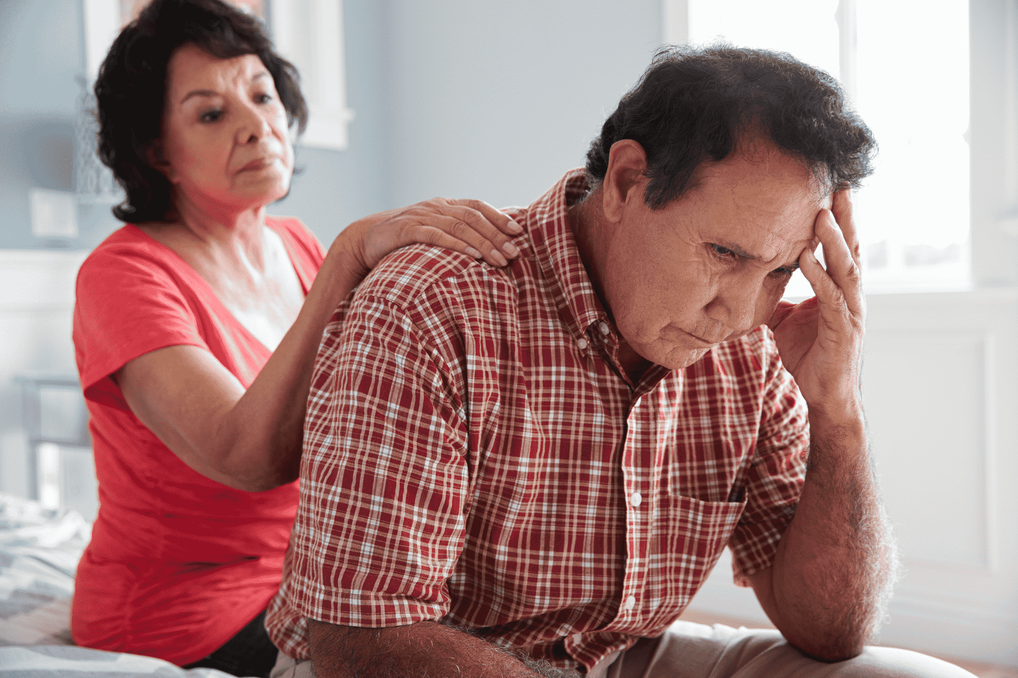 worried elderly couple