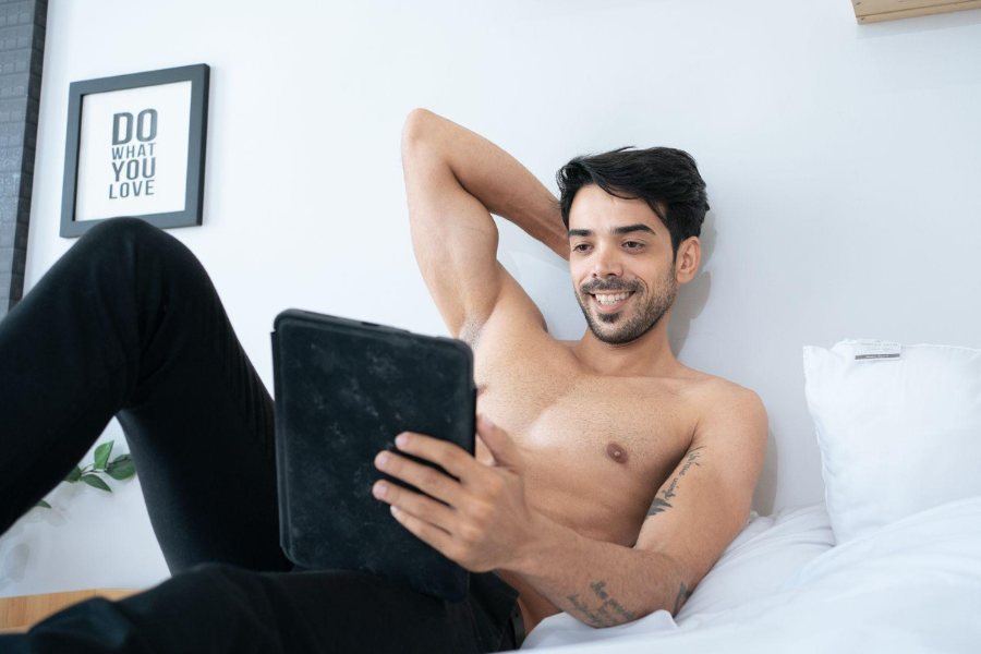 young in bed watching porn