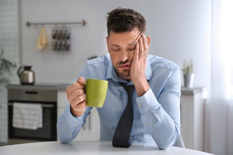 man struggling to stay awake