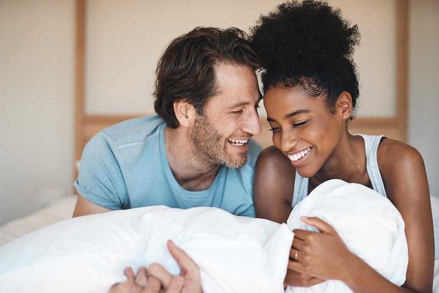 happy couple in bed