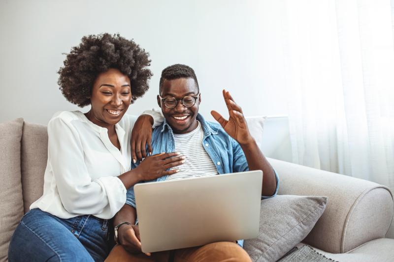 happy young couple on an online couples counseling session